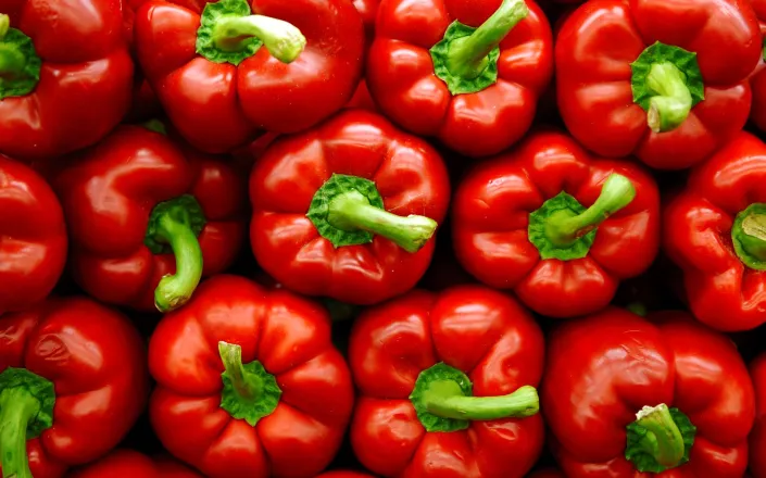 Vibrant stack of red peppers